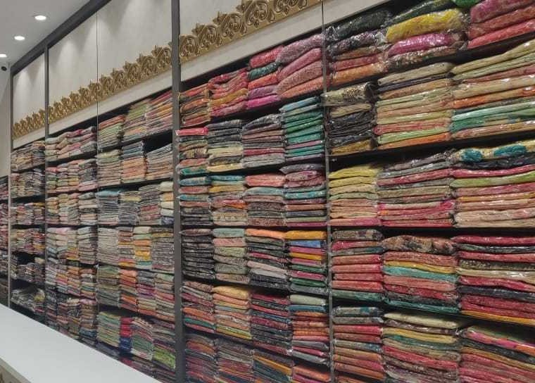 Inside Sapphire Kharghar showroom showing floor-to-ceiling shelves of sarees